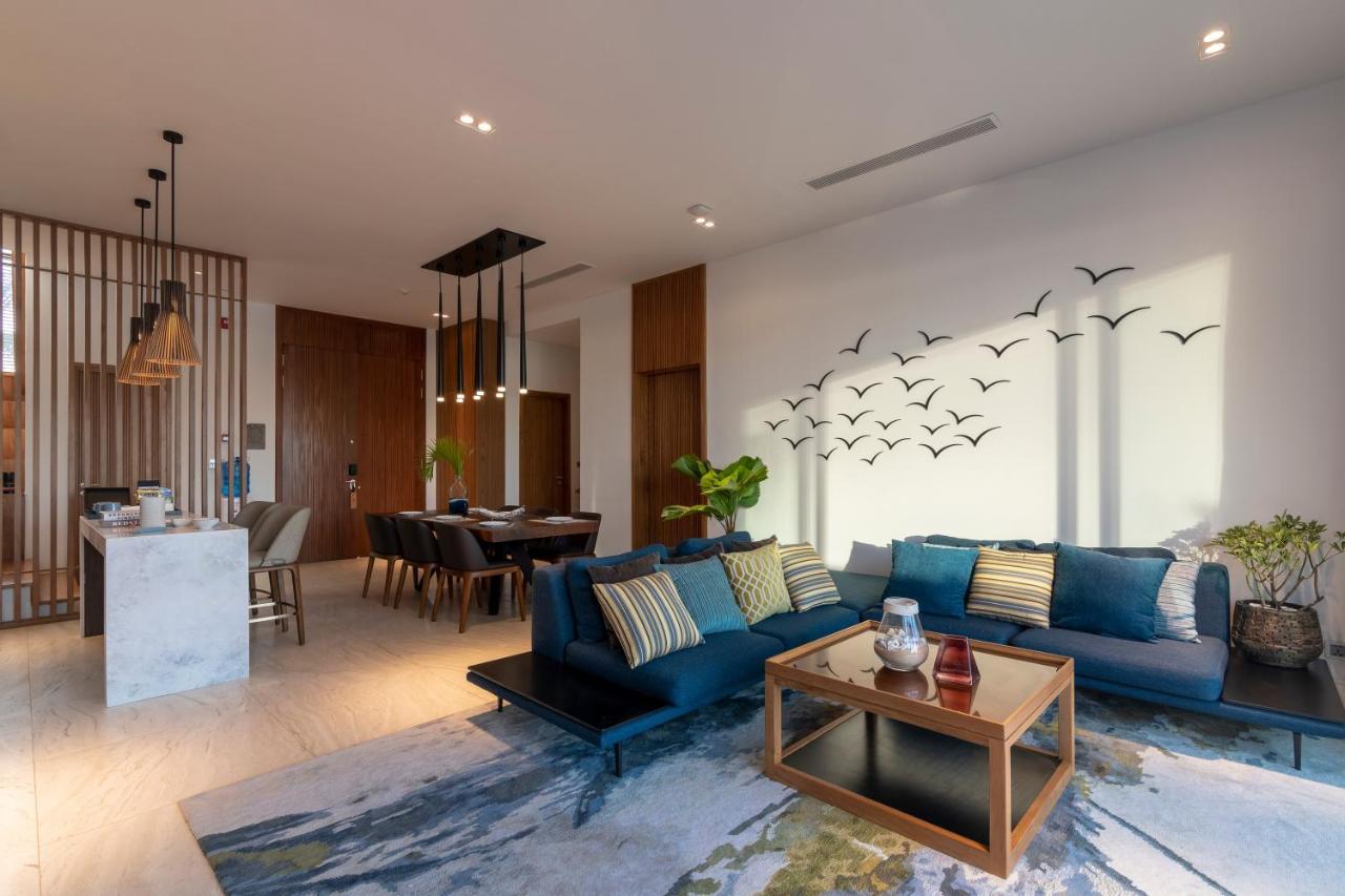 Mövenpick Villas&Residences Phú Quốc Exterior foto A living room in a condominium